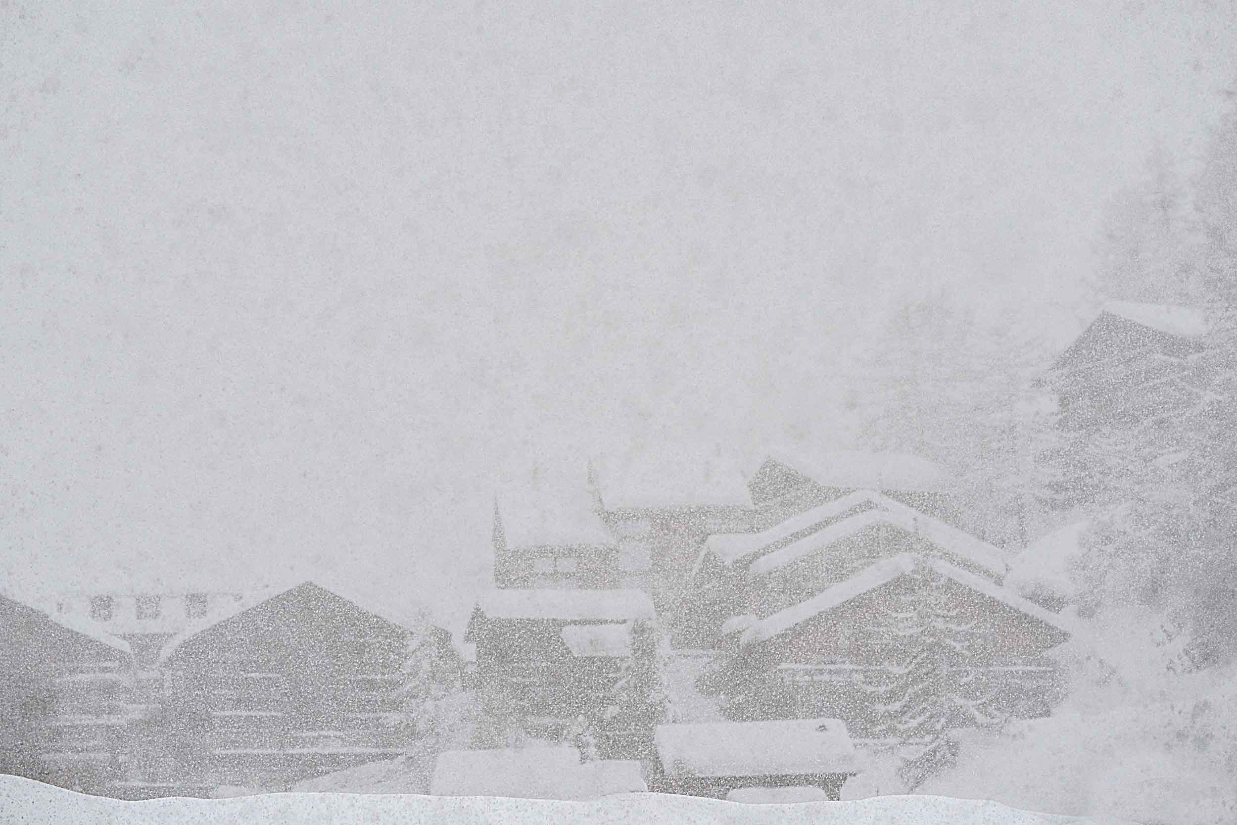 Houses in white out blizzard conditions